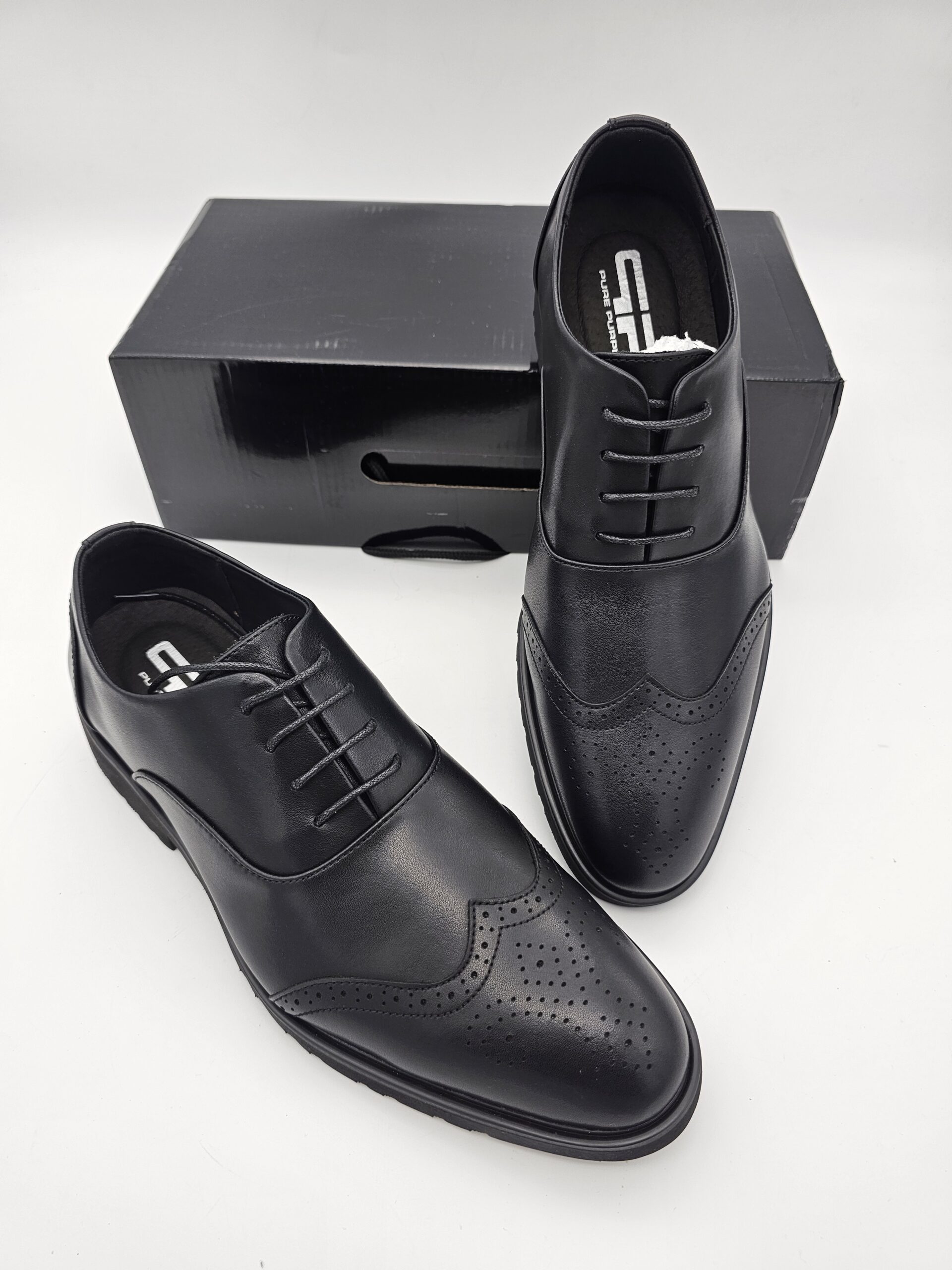 Black leather Oxford shoes for men by Pure Purple featuring genuine leather uppers, padded insoles and durable rubber soles.